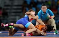 RIO DE JANEIRO, BRAZIL - AUGUST 17:  Sakshi Malik (R) of India competes against Valeriia Koblova Zholobova of Russia during a Women's Freestyle 58kg Quarterfinal bout on Day 12 of the Rio 2016 Olympic Games at Caioca Arena 2 on August 17, 2016 in Rio de Janeiro, Brazil.  (Photo by Lars Baron/Getty Images)